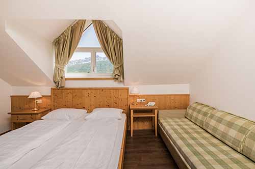 le camere per famiglie numerose dell'hotel kronplatz del trentino alto adige